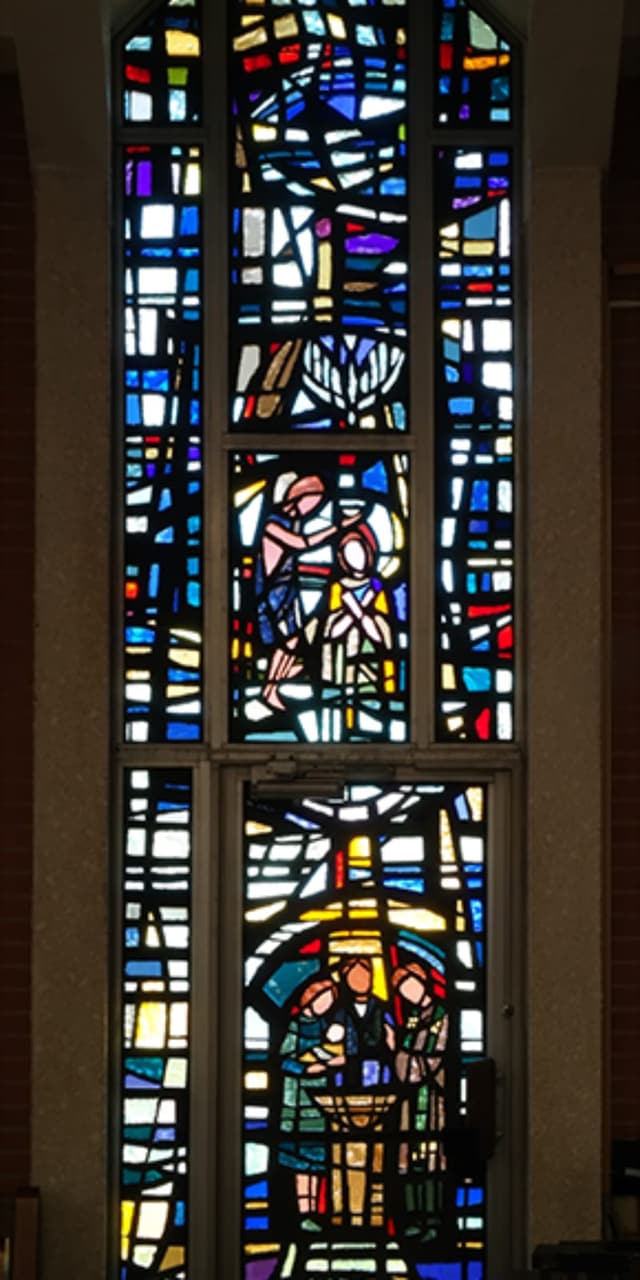 Chapel stained-glass window in blues and greens