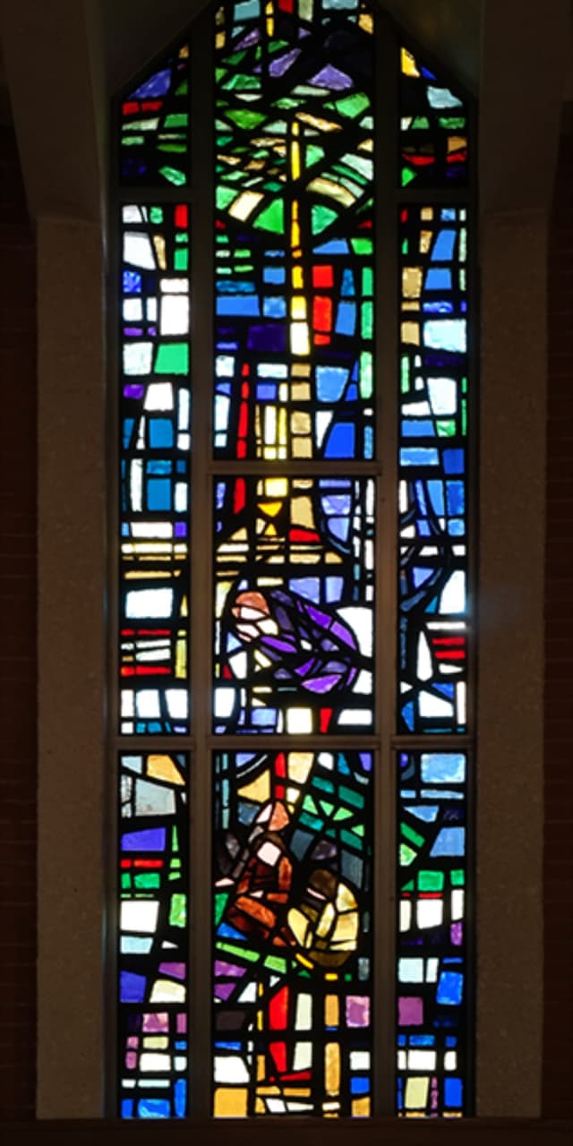 Chapel stained-glass window in vivid reds and golds